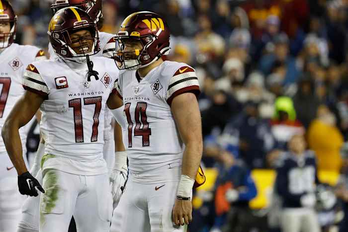 Washington Commanders quarterback Sam Howell (14) and receiver Terry McLaurin (17) celebrate a play in Week 18.